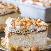 Caramel Cashew Ice Cream Dessert - Creamy vanilla ice cream on a shortbread cookie crust, topped with homemade caramel sauce and cashews of course!