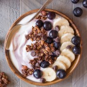 Chocolate Hazelnut Granola Yogurt Bowl - Creamy yogurt topped with blueberries, bananas and homemade Chocolate Hazelnut Granola.