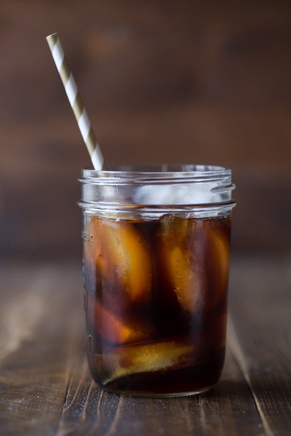 Cold Brew Iced Coffee in a glass jar with a straw.  