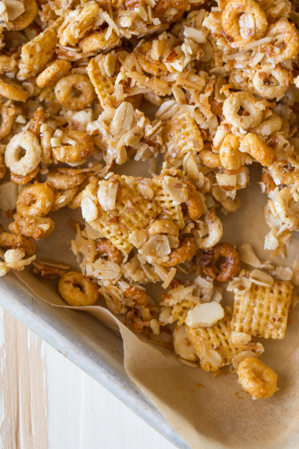Healthier Coconut Almond Chex Mix on a parchment paper lined baking sheet.  