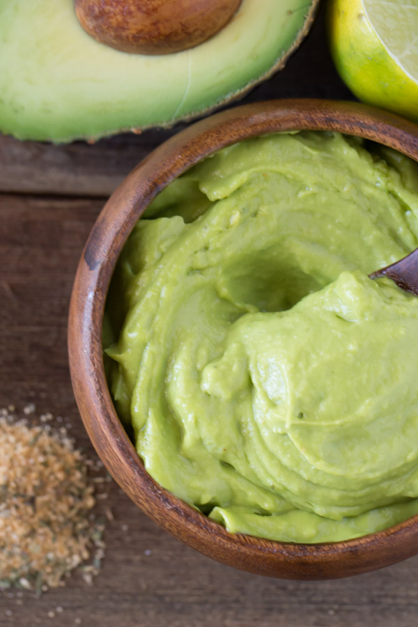 Whipped Avocado Cream in a small wood bowl.  