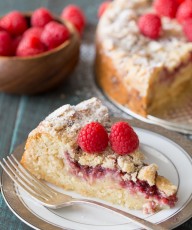 Raspberry Almond Coffee Cake - Layers of moist almond cake, sweetened cream cheese, raspberry preserves and an almond streusel topping.
