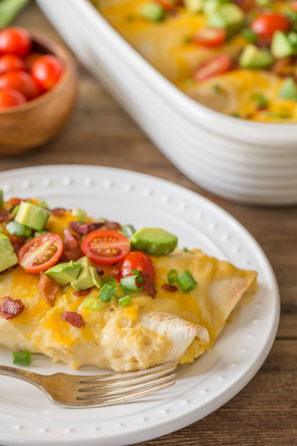 Breakfast Enchilada Bake on a plate with a fork.  