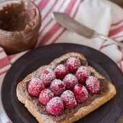 Chocolate Hazelnut Raspberry Toast - Homemade chocolate hazelnut spread on toast with fresh raspberries and powdered sugar.