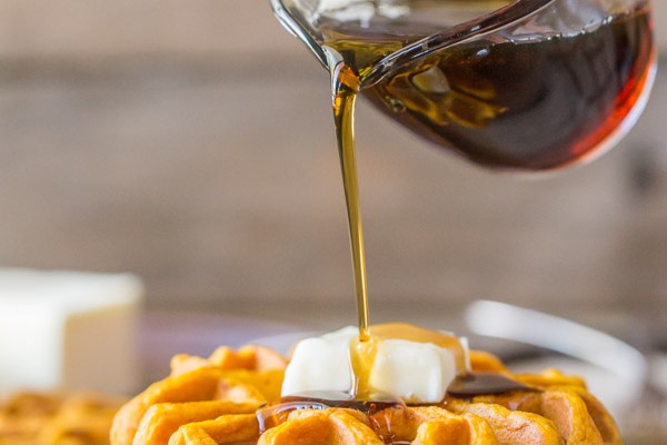 Pumpkin Spice Waffles - Made with pure pumpkin puree and coconut oil, these waffles are moist, fluffy and ready for maple syrup!