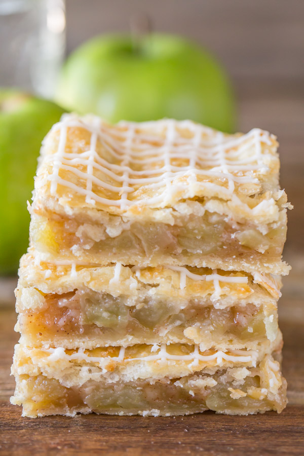 Three Iced Apple Pie Bars stacked on top of each other.  