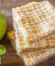 Iced Apple Pie Bars - Perfectly spiced squares of apple pie with crisscross icing on top!