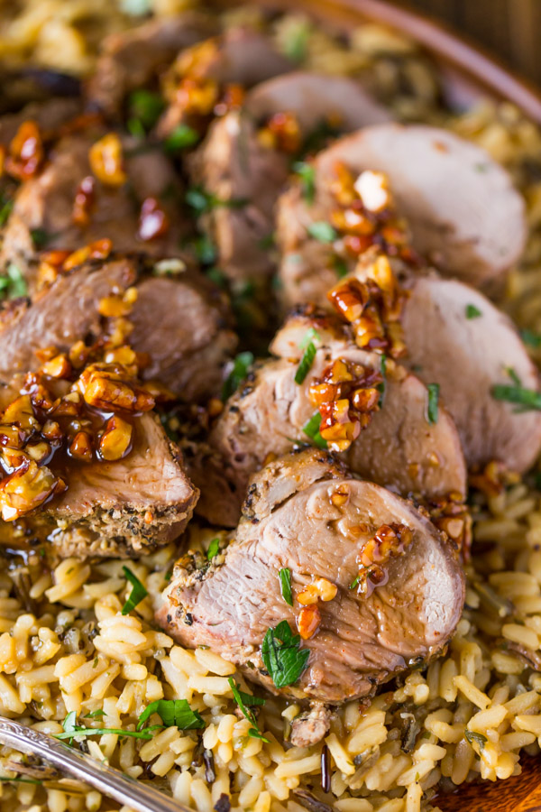 Pork Tenderloin sliced and served over rice and topped with a Sweet Chili Pecan Glaze.