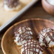 Stuffed Chocolate Almond Macaroons - Coconut macaroons flavored with vanilla and almond, stuffed with a mini sized candy bar and drizzled with chocolate!