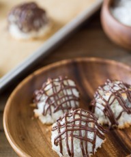 Stuffed Chocolate Almond Macaroons - Coconut macaroons flavored with vanilla and almond, stuffed with a mini sized candy bar and drizzled with chocolate!