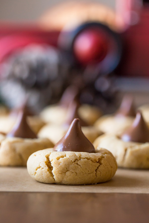 No Shortening Peanut Butter Blossoms sitting on a piece of parchment paper.