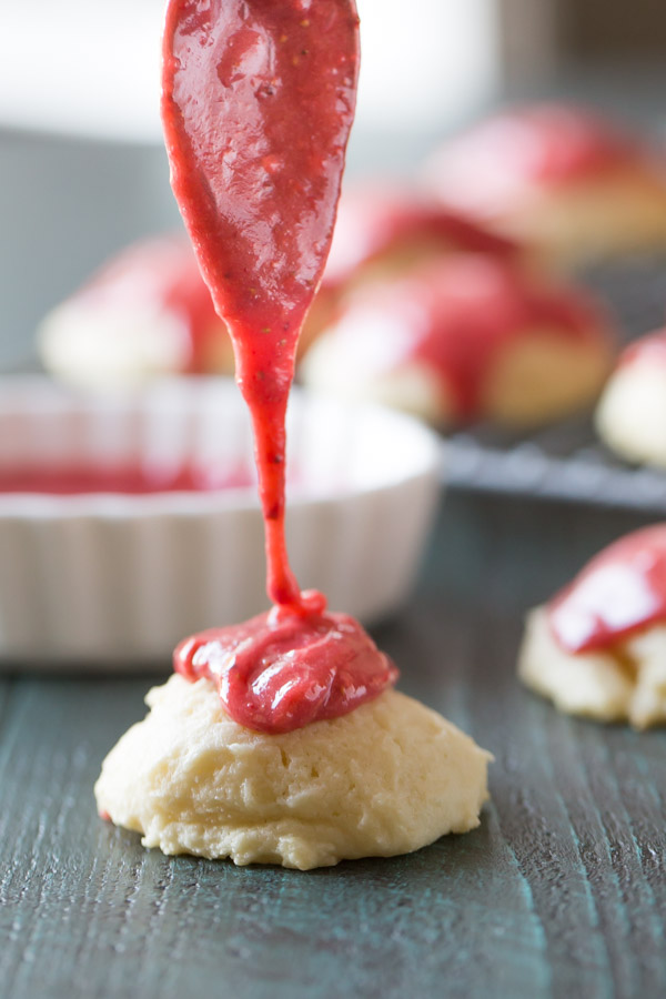 Strawberry Glaze being spooned over a Ricotta Cookie.
