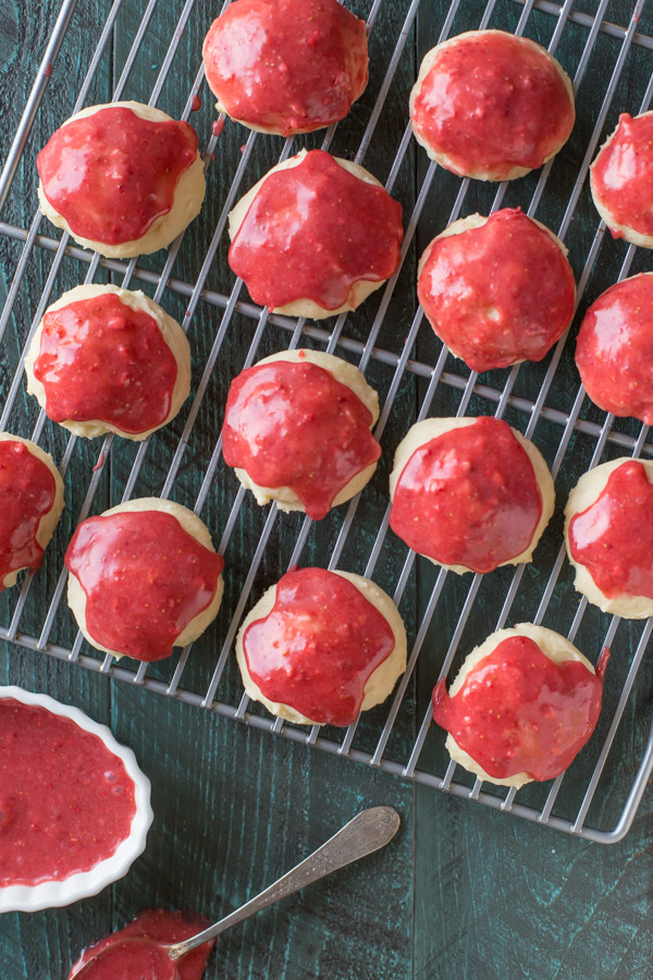 Strawberry Glazed Ricotta Cookies on a cooling rack.  