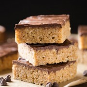 Chocolate Peanut Butter Rice Krispie Bars - Rice Krispie Bars with a caramel base, peanut butter, and a chocolate topping! Something good made even better!