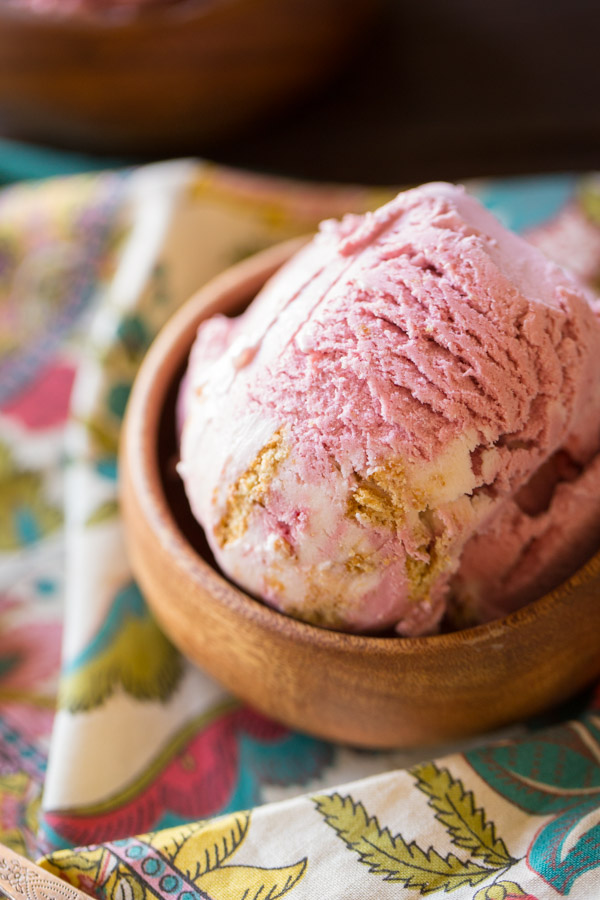 Homemade Raspberry Cheesecake Ice Cream in a small wood bowl.  