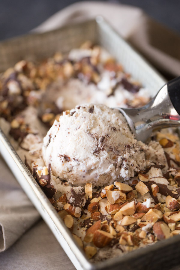 Dark Chocolate Almond Ice Cream being scooped from a loaf pan.  