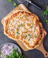 Barbeque Chicken Pizza - Homemade pizza dough topped with barbecue sauce, grilled chicken, mozzarella cheese and red onions. A family favorite!