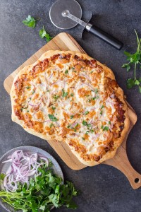 Barbeque Chicken Pizza - Homemade pizza dough topped with barbecue sauce, grilled chicken, mozzarella cheese and red onions. A family favorite!