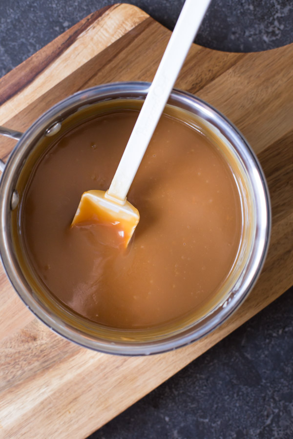 Caramel in a sauce pan with a spatula. 