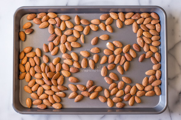 Almonds on a baking sheet.  