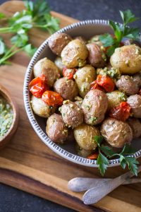 A quick and easy alternative to your typical potato salad, these Roasted Baby Potatoes are tossed with roasted tomatoes and homemade pesto!