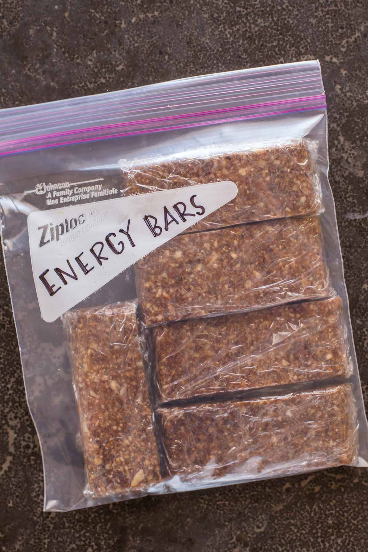 Five Ingredient No Bake Energy Bars individually wrapped in plastic, inside a Ziploc bag labeled Energy Bars. 