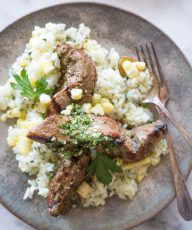 Celebrating all the bold flavors of Brazil with this recipe for marinated flank steak served over chimichurri rice!