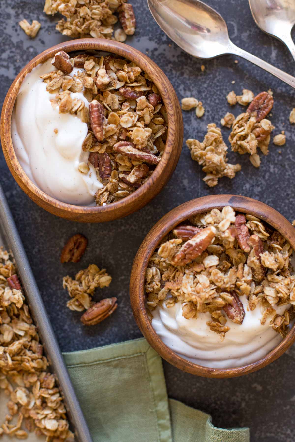Two bowls of yogurt and Gingerbread Spice Granola. 