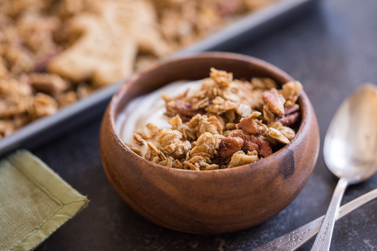 A bowl of yogurt and Gingerbread Spice Granola. 