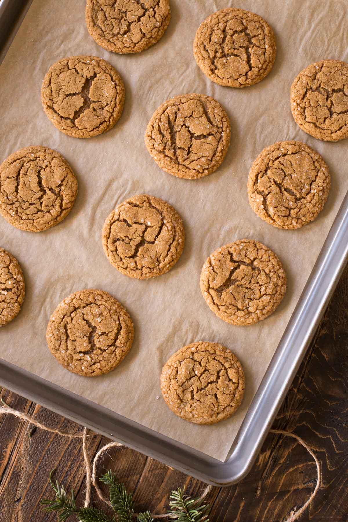 Old Fashioned Ginger Snaps on a parchment paper lined baking sheet. 