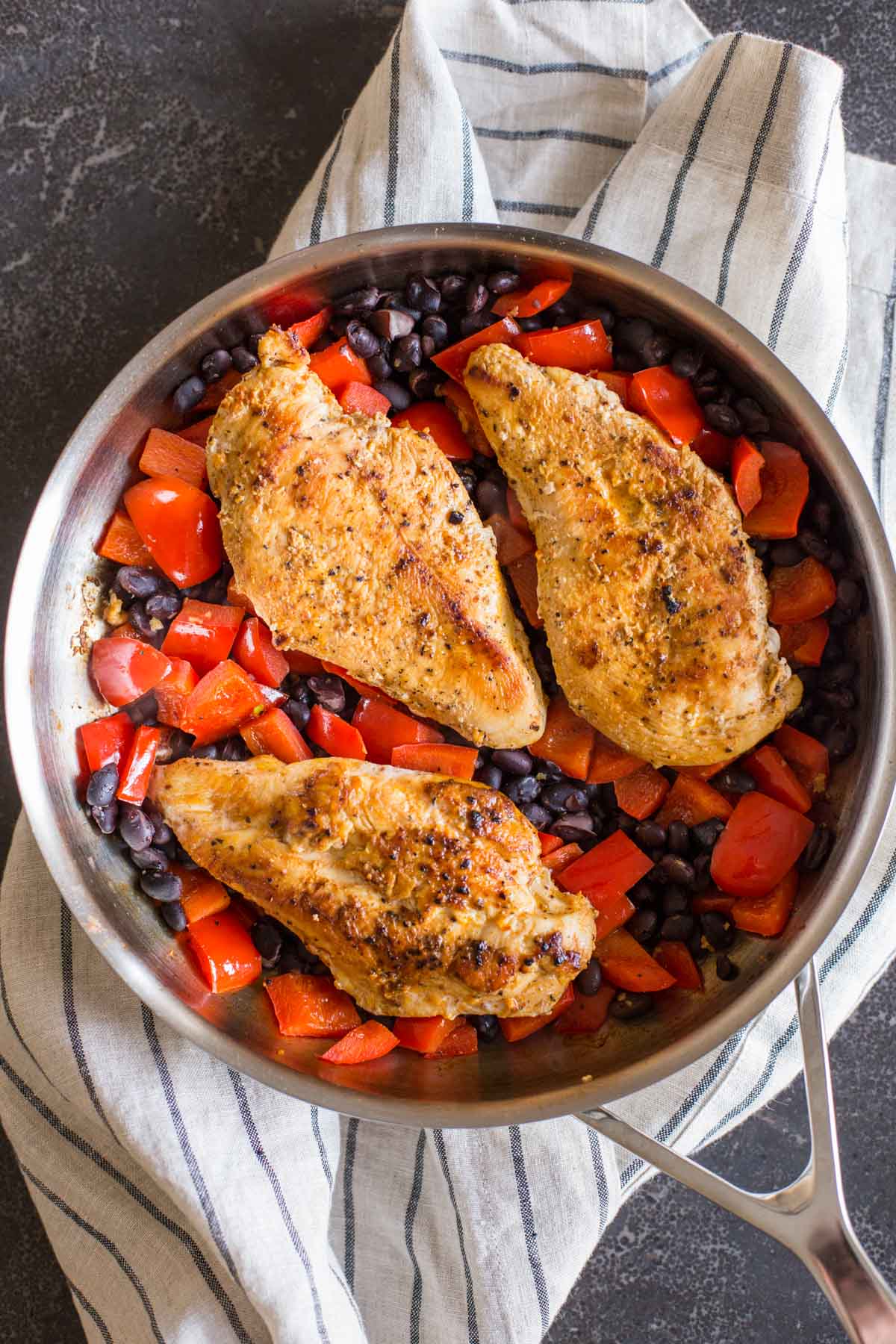 A skillet with all the ingredients for the Healthy Southwestern Chicken Bowls.