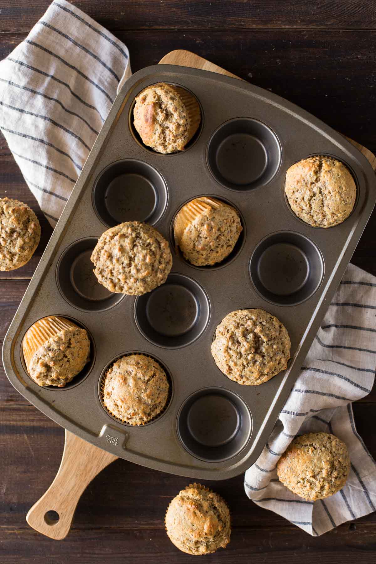 Honey Bran Muffins in, on and around a muffin pan.  