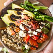 These BLT Bliss Bowls have so much going on! They've got mixed baby greens, oven roasted tomatoes, crisp bacon, avocado, nutty quinoa, and creamy feta.