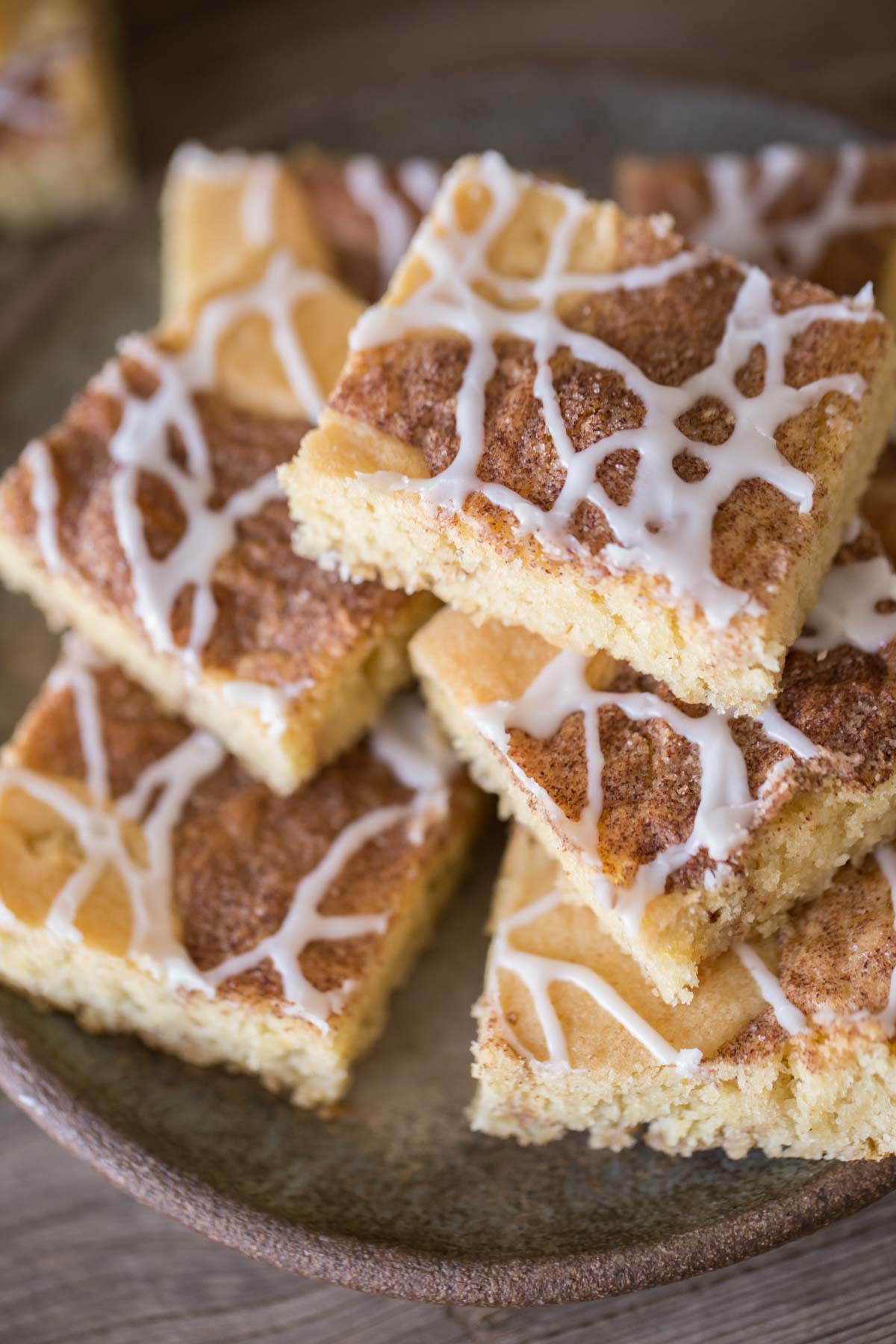 Snickerdoodle Bars stacked on a plate.  