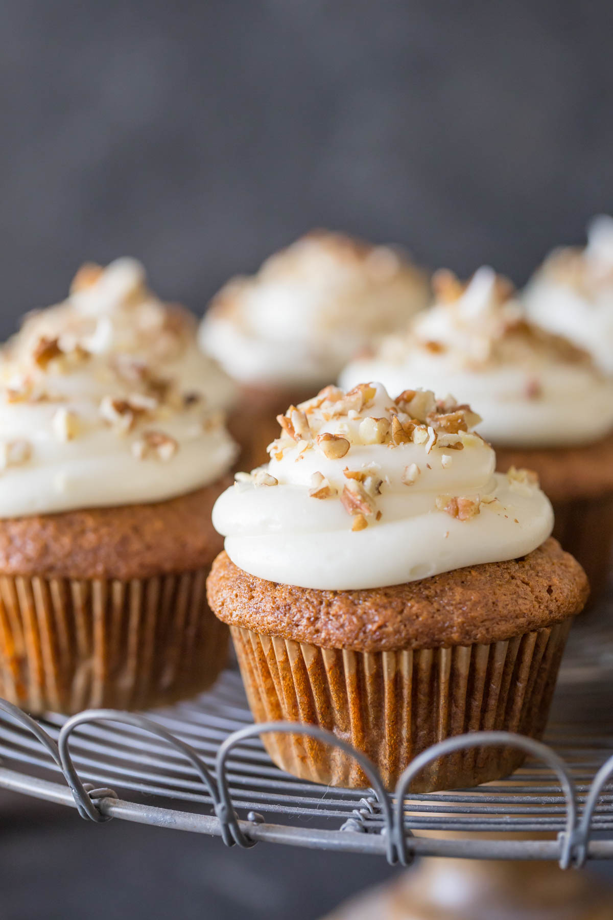 Carrot Cake Cupcakes on a cake stand.  