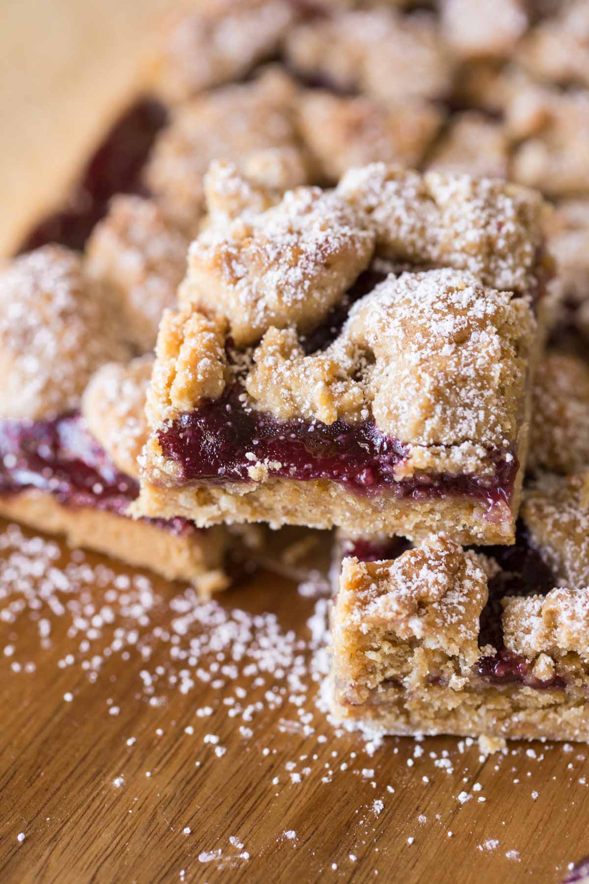 Peanut Butter and Jelly Oat Bars dusted with powdered sugar. 