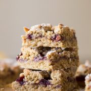 These Peanut Butter and Jelly Oat Bars have a soft peanut butter cookie base, mixed berry preserves, and more crumbled peanut butter cookie dough!