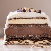 This Chocolate Peanut Butter Ice Cream Slice Cake is so clever, made with ice cream sandwiches, crunchy peanut butter ganache, and chocolate ice cream!