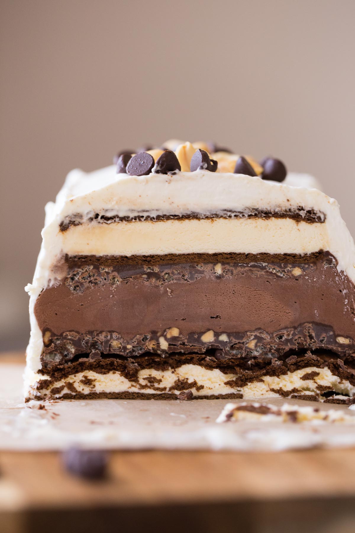 Chocolate Peanut Butter Ice Cream Slice Cake that has been sliced so it is showing the different layers. 