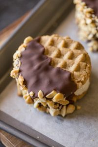 We've got soft peanut butter cookies with vanilla ice cream, a milk chocolate coating and crushed peanuts - OH MY!!! Just what summer needs!