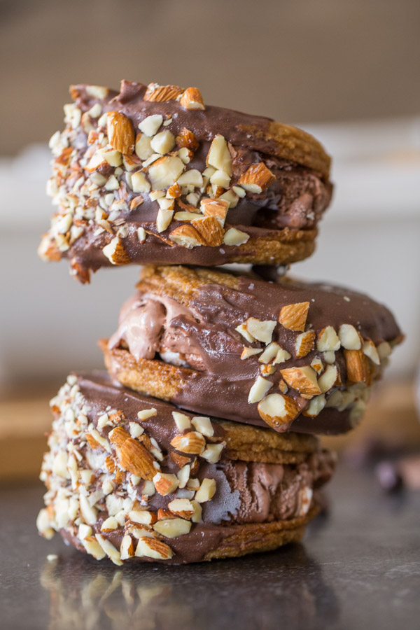 Three S’more Inspired Ice Cream Sandwiches stacked on top of each other. 