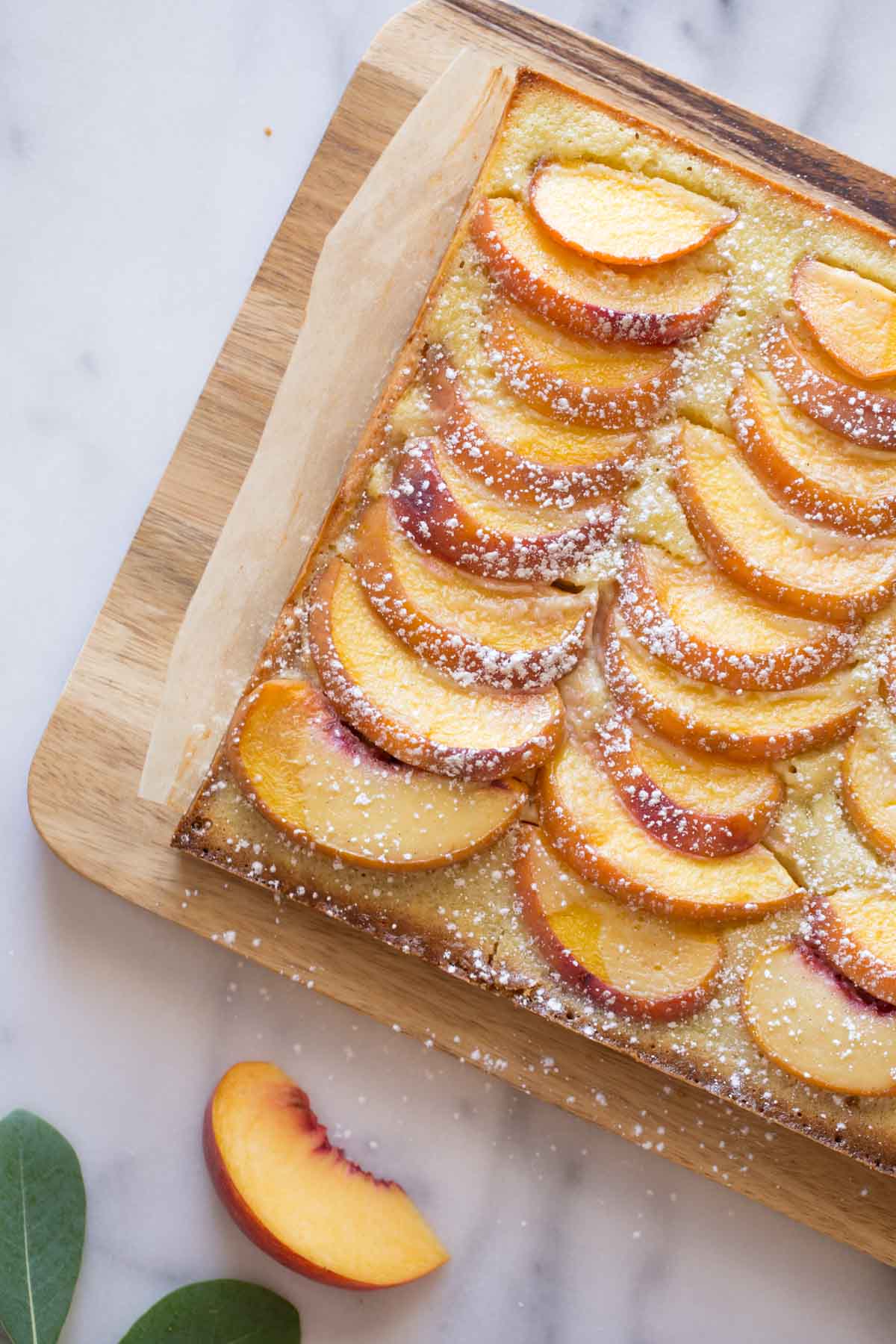 Peaches and Cream Shortbread Bars on a cutting board. 