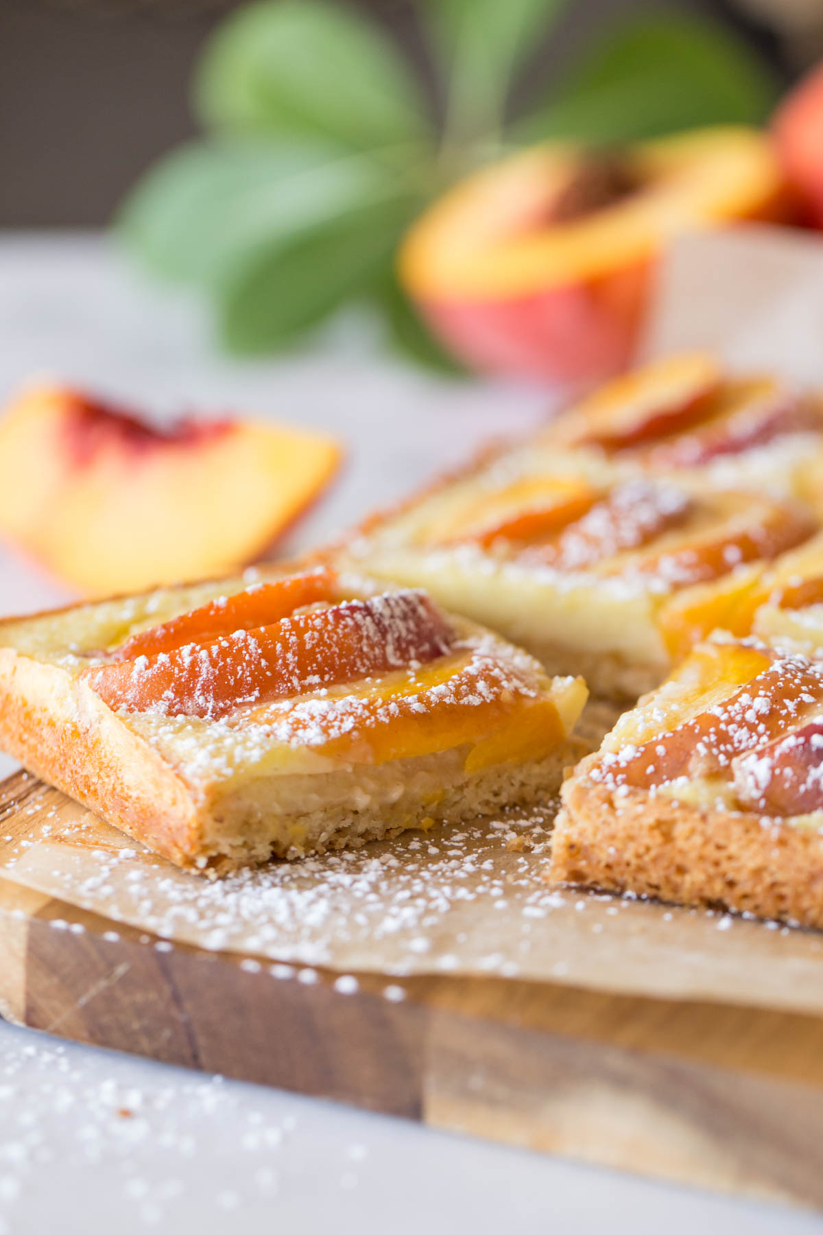 Peaches and Cream Shortbread Bars on a cutting board. 