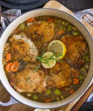 This rustic lemon rosemary chicken dish with orzo, white beans and vegetables comes together with layers of flavor in one dutch oven in about an hour.