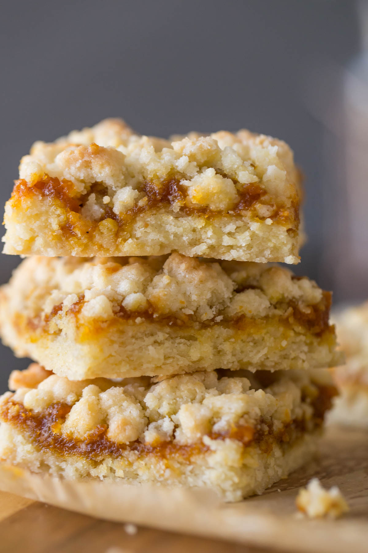 Three Pumpkin Butter Crumb Bars stacked on top of each other. 