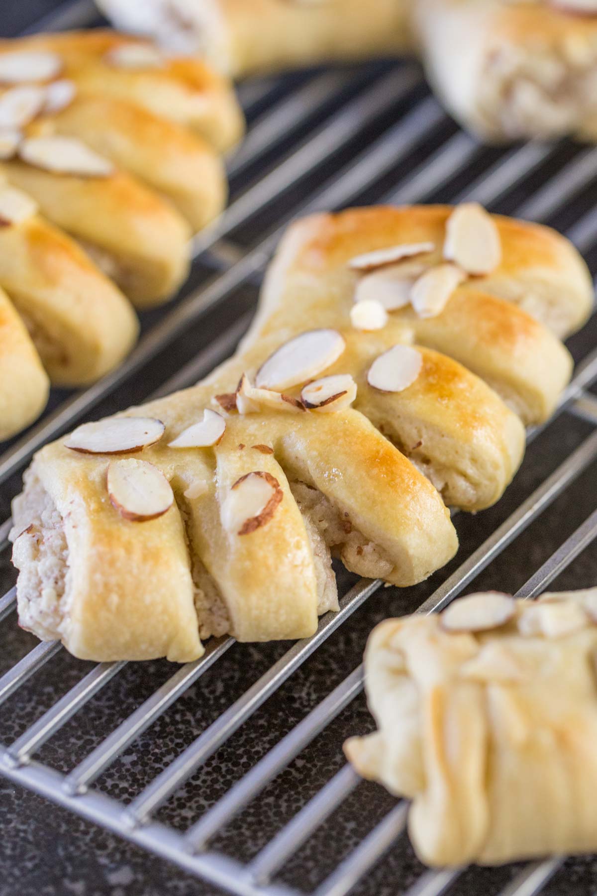 Buttery Almond Bear Claws on a cooling rack. 