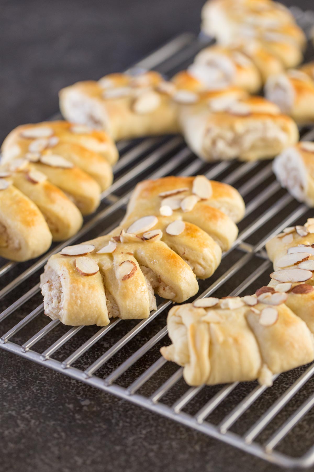 Buttery Almond Bear Claws on a cooling rack. 