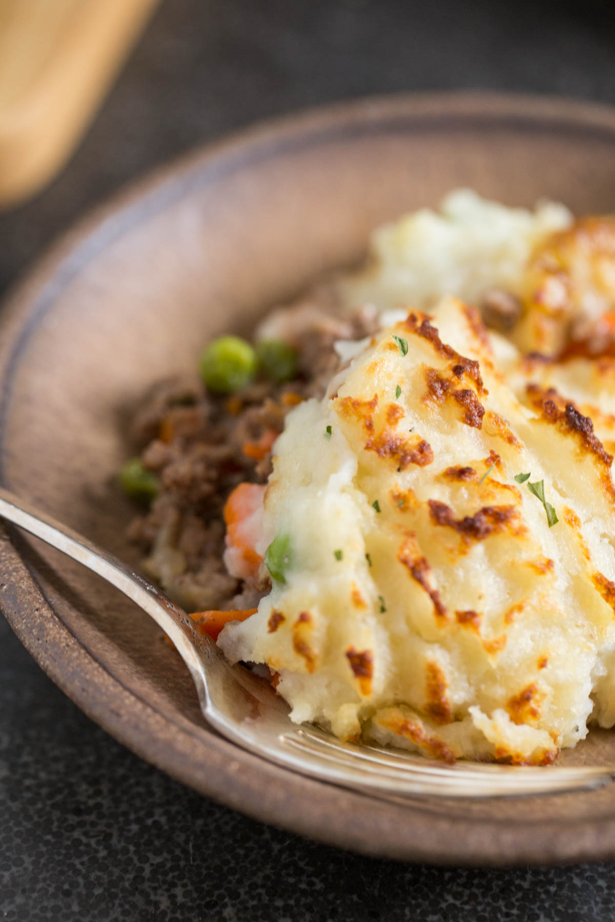 Easy Homemade Shepherd's Pie on a plate with a fork. 