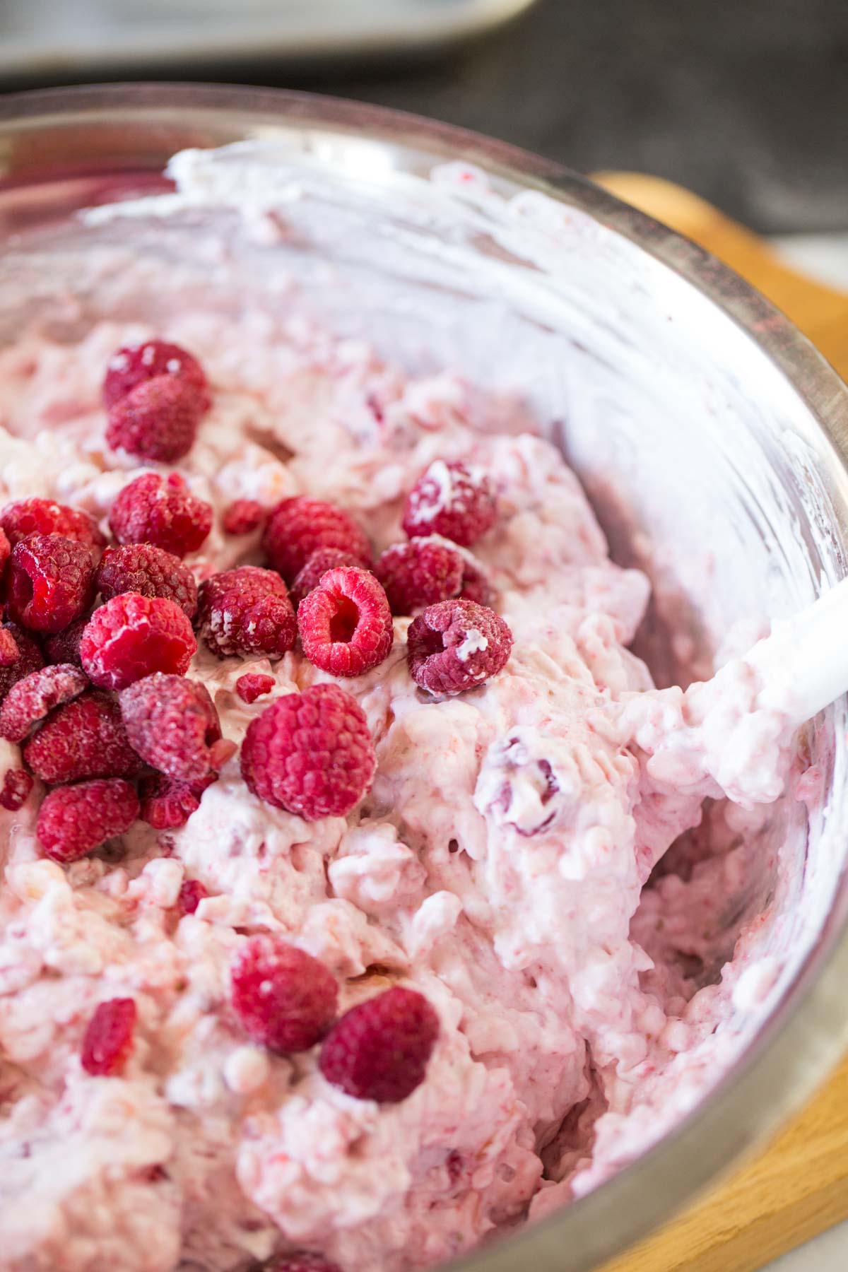 In process shot of Very Berry Fluffy salad with raspberries folded in