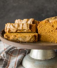 Slices of Easy Pumpkin Bread on a metal cake stand.